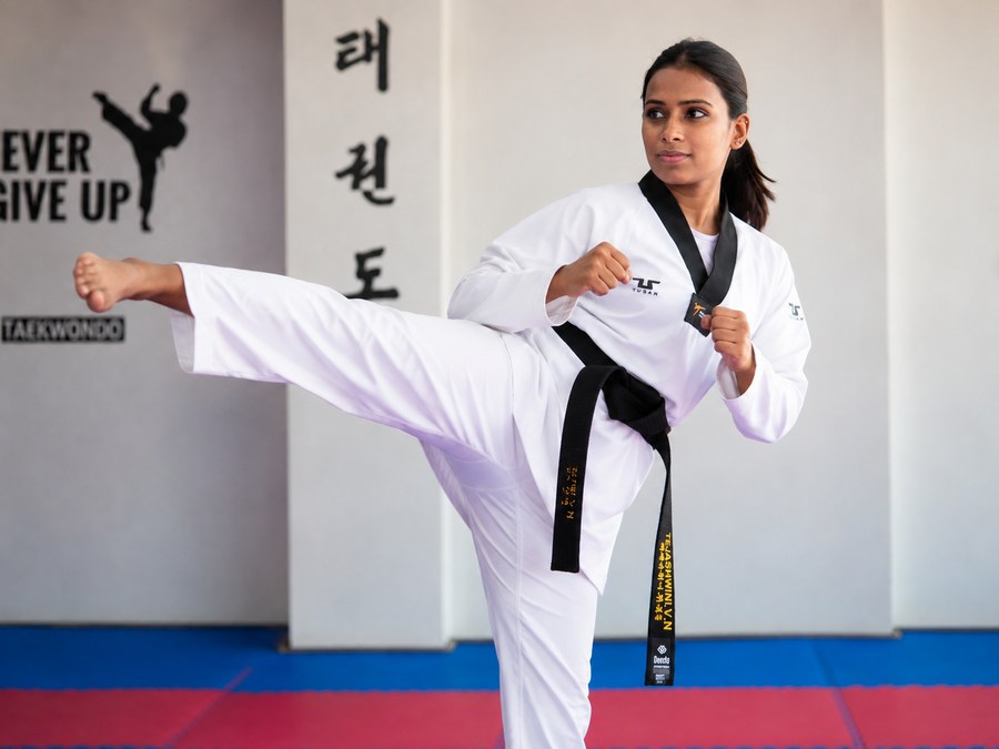 Master Tejashwini VN executing a side kick during training